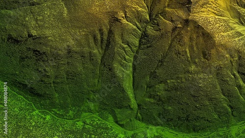 Digital elevation model. GIS product made after proccesing aerial pictures taken from a drone. It shows high rocky and steep mountain peaks. At their feet are visible valleys and mountain lakes