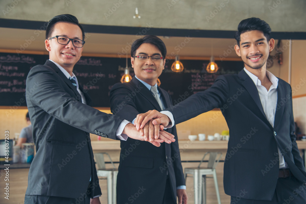 Group of diversity people fist bump holding hands together power of tag team. Teamwork Multiethnic people group working togetherness. Business people team holding hands successful. Business meeting Group of diversity people fist bump holding hands together power of tag team. Teamwork Multiethnic people group working togetherness. Business people team holding hands successful. Business meeting
