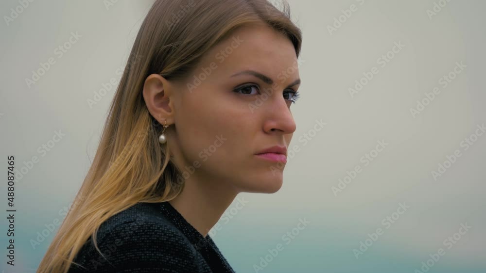 Young sad businesswoman alone front of the sea Young sad businesswoman alone front of the sea