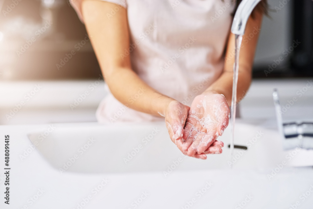Practice good hygiene. Closeup shot of an unrecognizable woman washing her hands. Practice good hygiene. Closeup shot of an unrecognizable woman washing her hands.