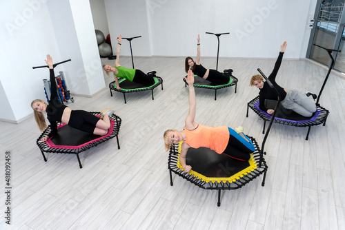 Trampoline for fitness girls are engaged in professional sports, the concept of a healthy lifestyle jumping trampoline woman fitness sport training, from exercise active for leap and energy wellness