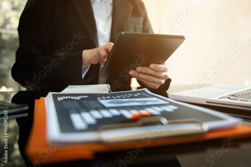 Businesswoman using mobile phone.Closeup on blurred background. © laddawan