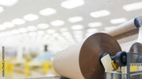 Big paper roll in production, blur background.