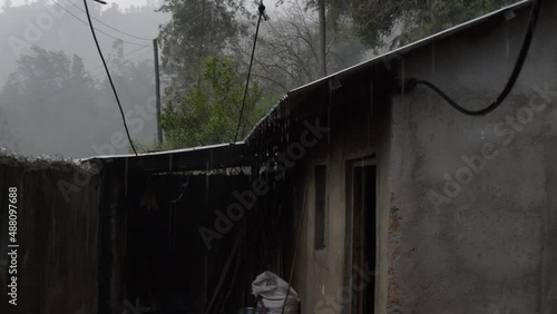 house in the woods in rain