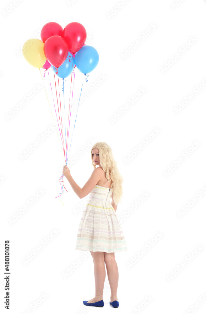 Full length portrait of blonde girl wearing party dress, holding bunch of colourful balloons. Isolated on white studio background
Full length portrait of blonde girl wearing party dress, holding bunch of colourful balloons. Isolated on white studio background