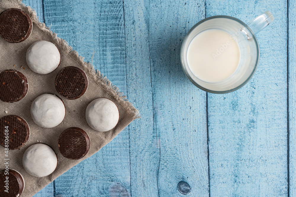 Homemade cookies with nuts, chocolate and milk on a wooden table and art background. Breakfast. Close. Homemade cookies with nuts, chocolate and milk on a wooden table and art background. Breakfast. Close.