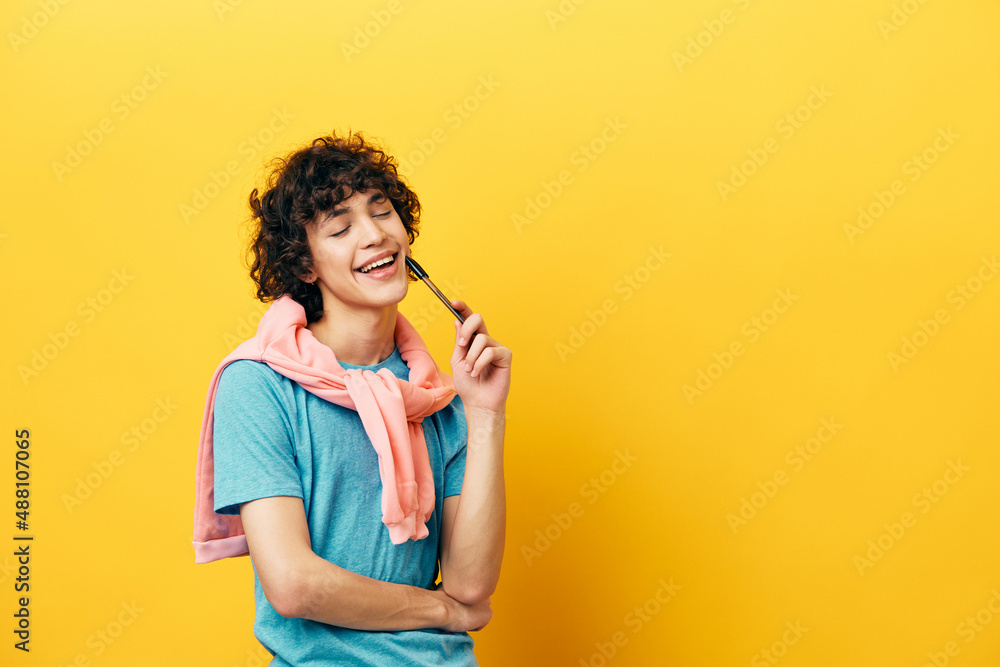 student with a pencil in hand thought process yellow background student with a pencil in hand thought process yellow background