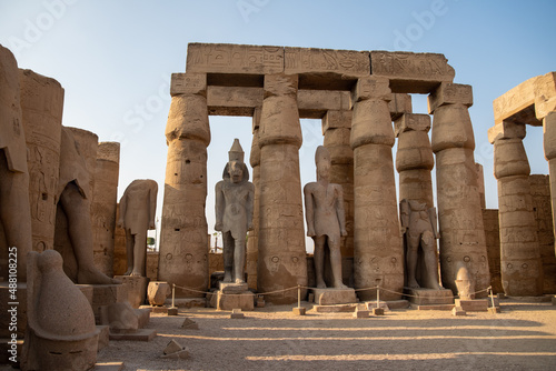 Columns and statues in the courtyard of Ramses II of the Luxor Temple. Luxor (destroyed Thebes). Egypt.