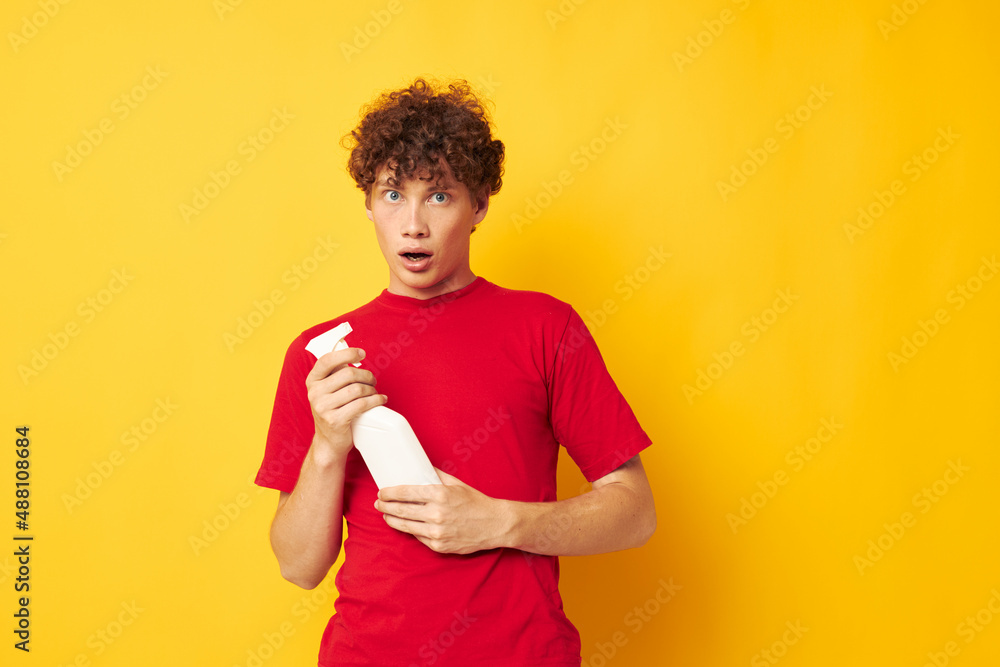 Young curly-haired man detergent posing emotion Lifestyle unaltered Young curly-haired man detergent posing emotion Lifestyle unaltered