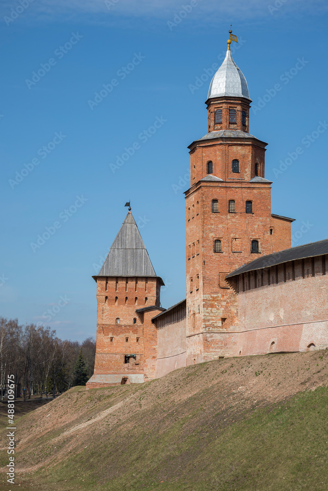 Ancient towers of Kokuy and Pokrovskaya on the Detinets of Veliky Novgorod on a sunny April day. Russia