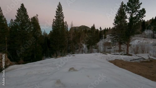 Sunset over distant peaks in Snowy Rocky Mountains