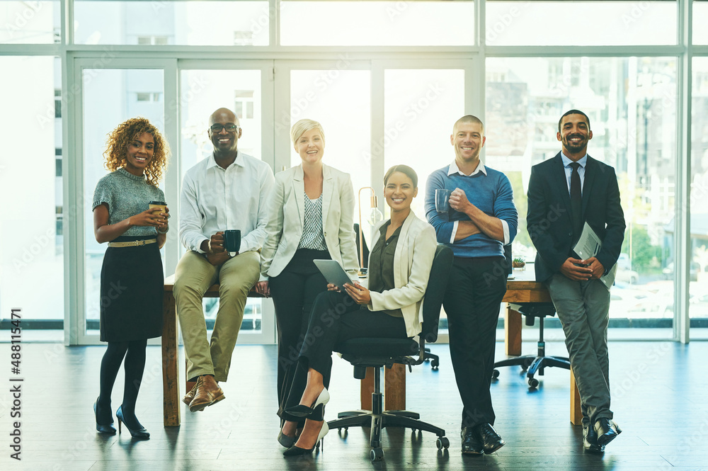 One team with one big dream. Portrait of a group of businesspeople in an office. One team with one big dream. Portrait of a group of businesspeople in an office.