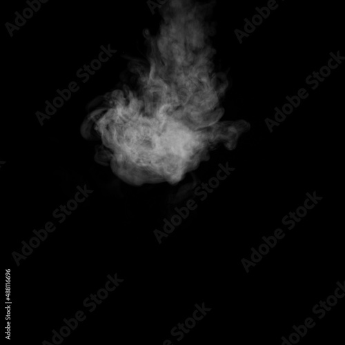 A swirling vapor isolated on a black background for overlaying on your photos. Fragment of vertical steam