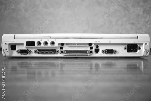 Input and output ports on vintage laptop background