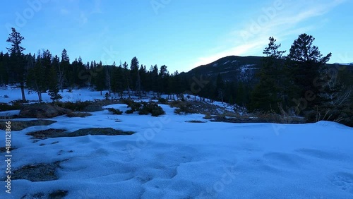 Sunset over a Snowy Horseshoe Park with Snowy Evergreen Trees in Colorado
