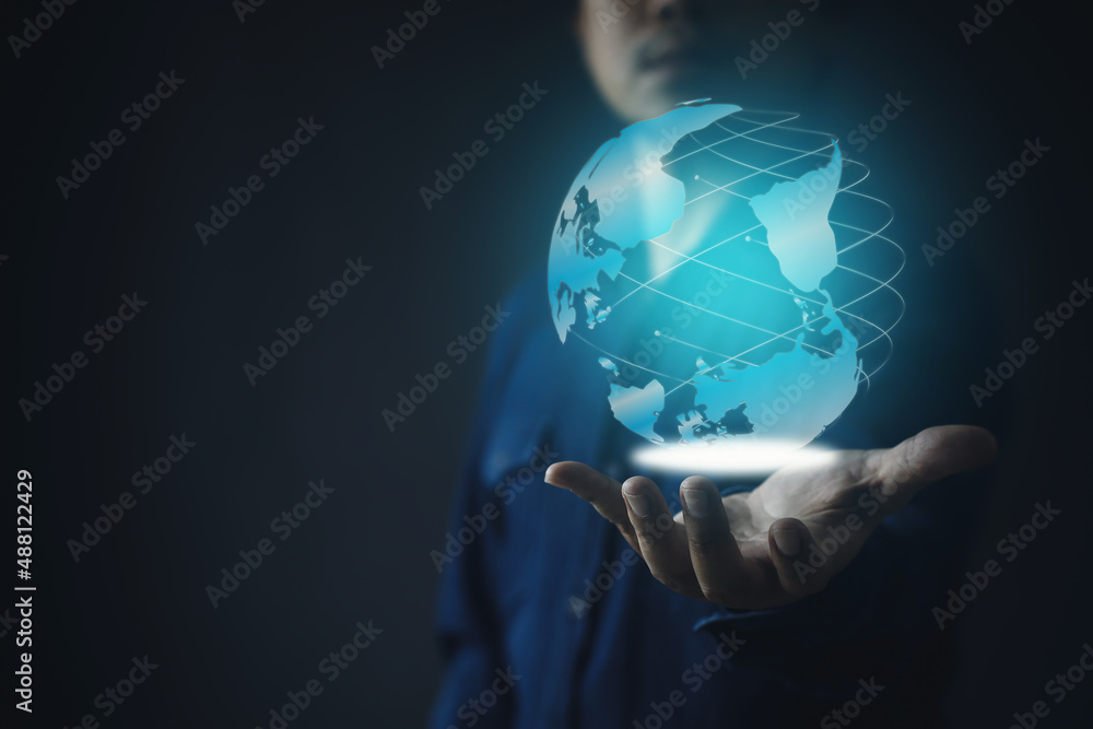 Businessman hand presenting a hologram globe Businessman hand presenting a hologram globe