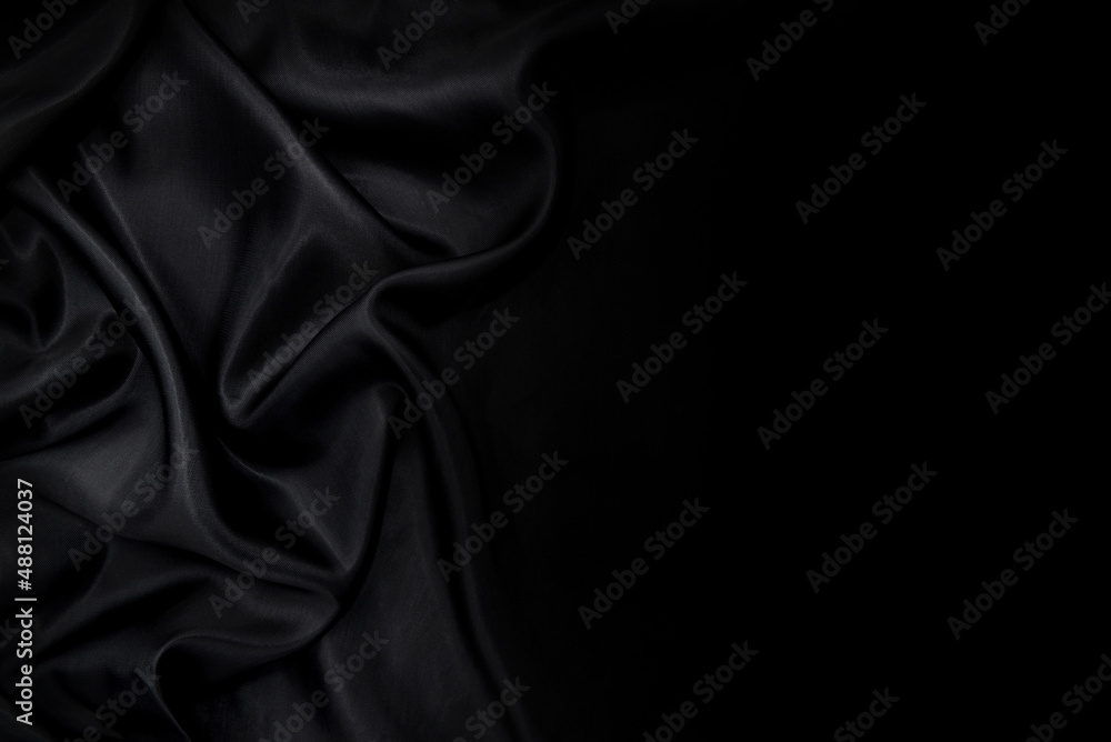 Part of the dark fabric texture of the fabric for the background and decoration of the work of art, a beautiful crumpled pattern of silk or linen. A crumpled piece of cloth Part of the dark fabric texture of the fabric for the background and decoration of the work of art, a beautiful crumpled pattern of silk or linen. A crumpled piece of cloth
