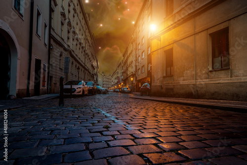 prague street paving stones burning lantern and starry night sky © luchschenF