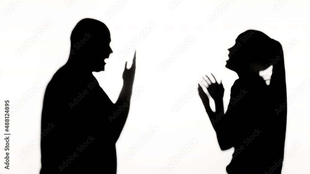 Man and woman quarrelling on white background. Shadows silhouette of couple having quarrel, family problems, conflicts in relationships. Man and woman quarrelling on white background. Shadows silhouette of couple having quarrel, family problems, conflicts in relationships.