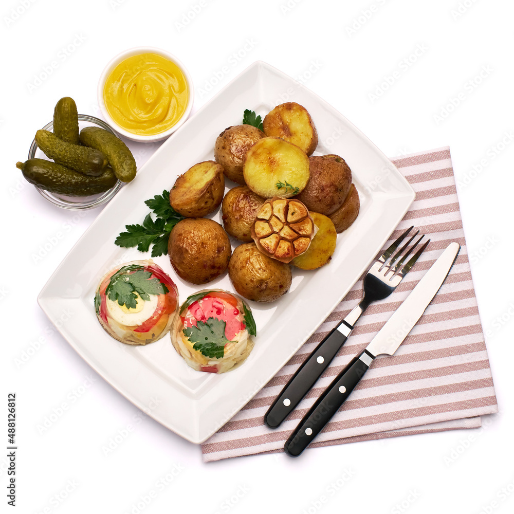 Portion of delicious chicken aspic and baked potato on a plate isolated on white background