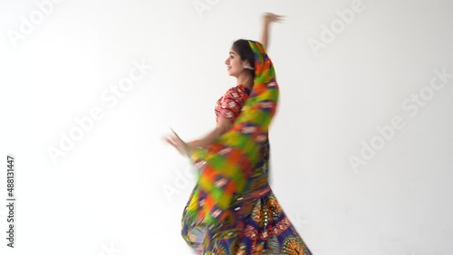 Beautiful indian woman dancing dance wearing ethnic indian dress. Welcome to India concept. Indian culture. photo