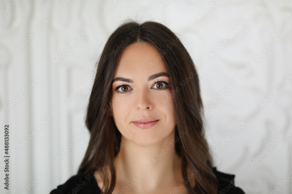 Portrait a beautiful brunette woman with long hair Portrait a beautiful brunette woman with long hair