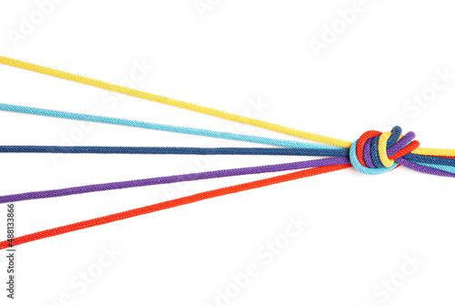 Five colored cords knotted together isolated