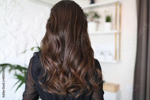 Beautiful long hair of a young brunette woman