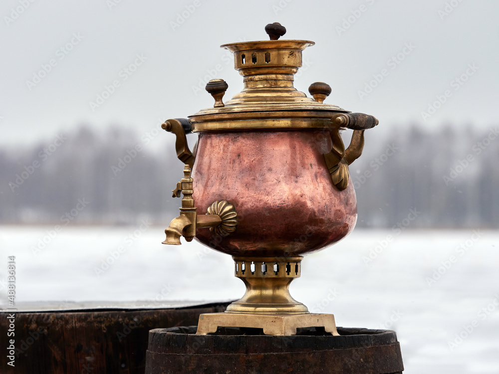 Fototapeta premium Russian samovar and winter landscape.