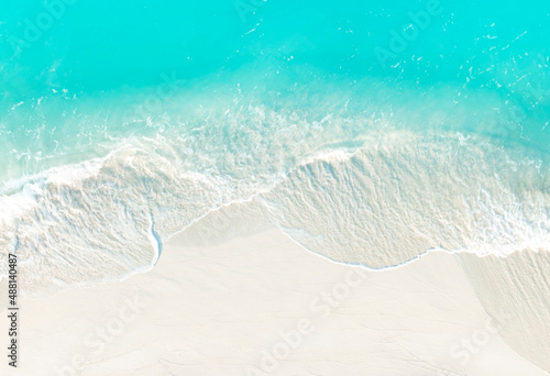 Top view of turquoise color of wave water background on the summer beach at the seashore and white sand beach -Summer pattern image