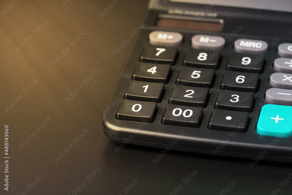 close-up of a calculator on a black close-up of a calculator on a black