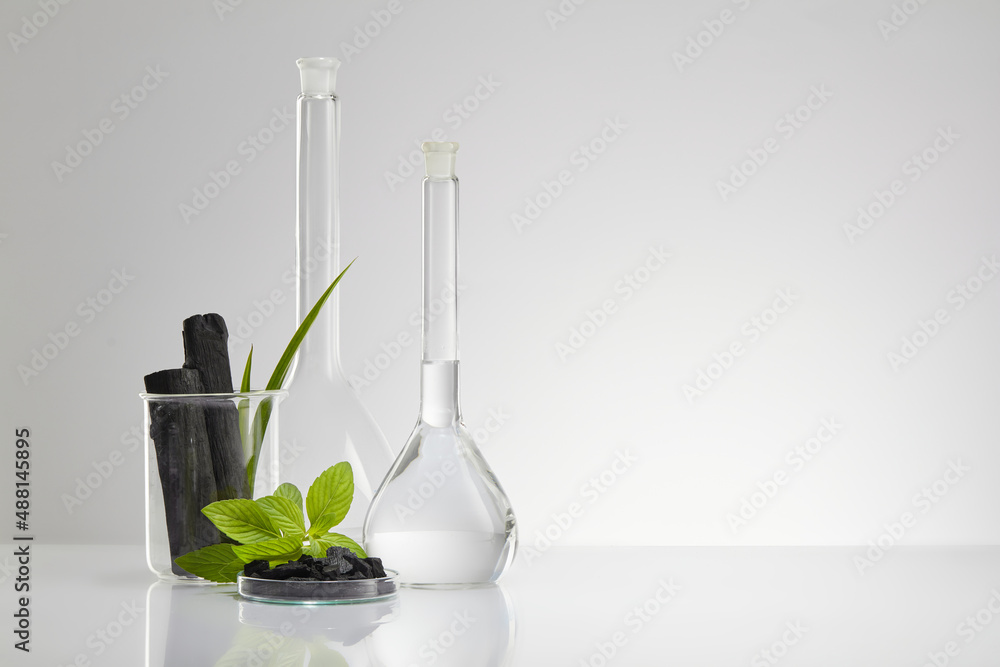 Activated charcoal research in laboratory with glassware beaker and