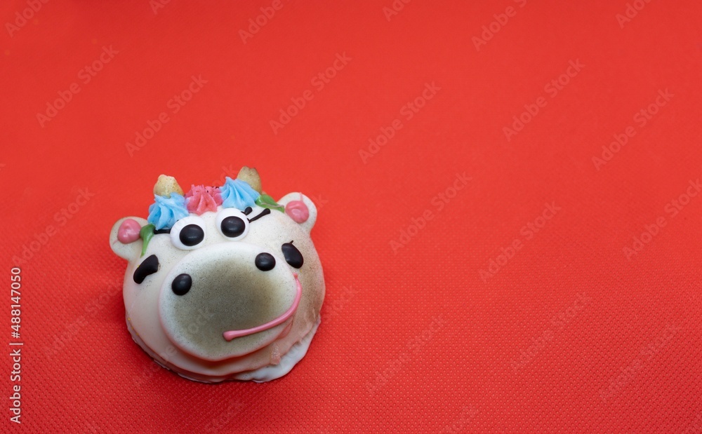chocolate cookies with cream. red background. cow chocolate cookies with cream. red background. cow