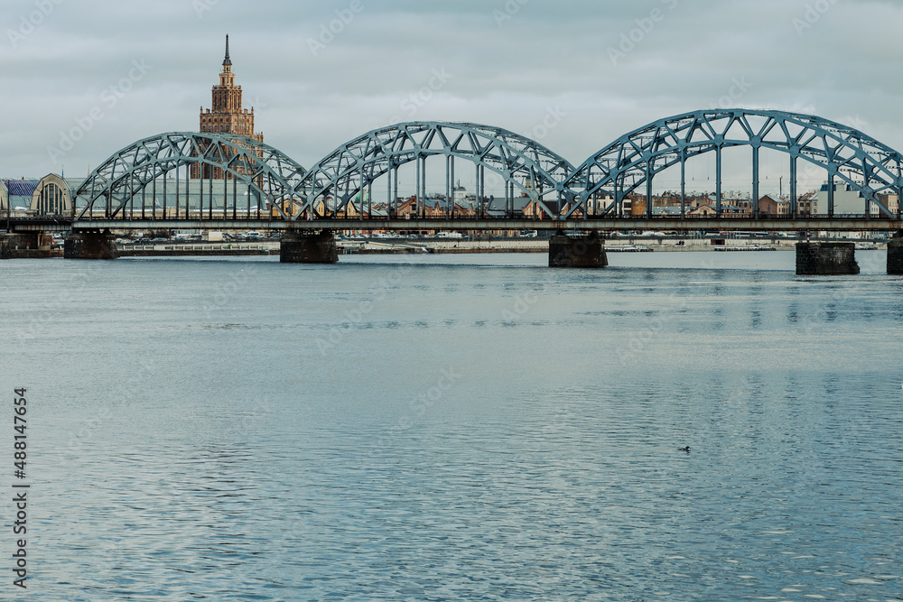 Railway Bridge over Daugava River. Riga Old Town. Medieval Gothic Architecture. Riga the capital of Latvia. Baltic states. Europe. Railway Bridge over Daugava River. Riga Old Town. Medieval Gothic Architecture. Riga the capital of Latvia. Baltic states. Europe.