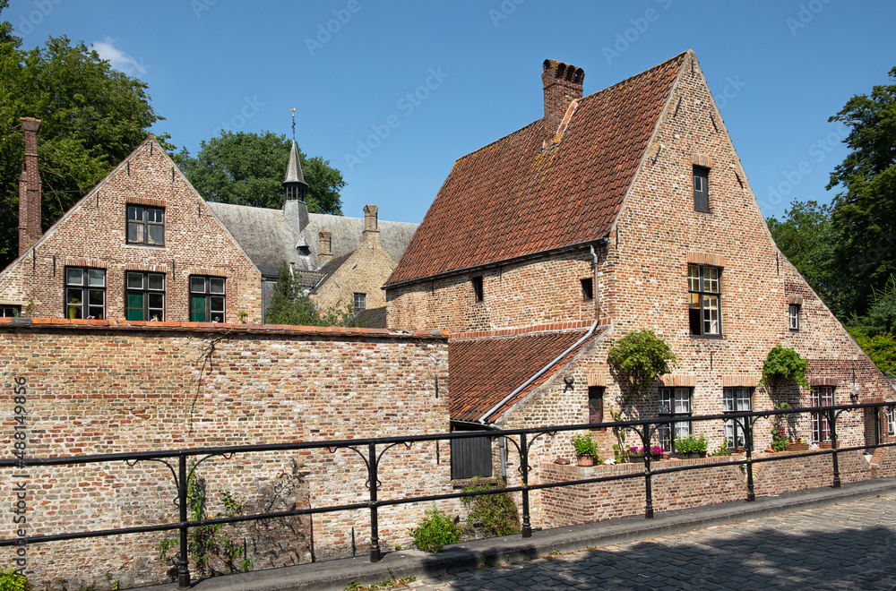 Medieval houses nearby the Princely Beguinage Ten Wijngaerde in the old part of Bruges, Belgium, Europe