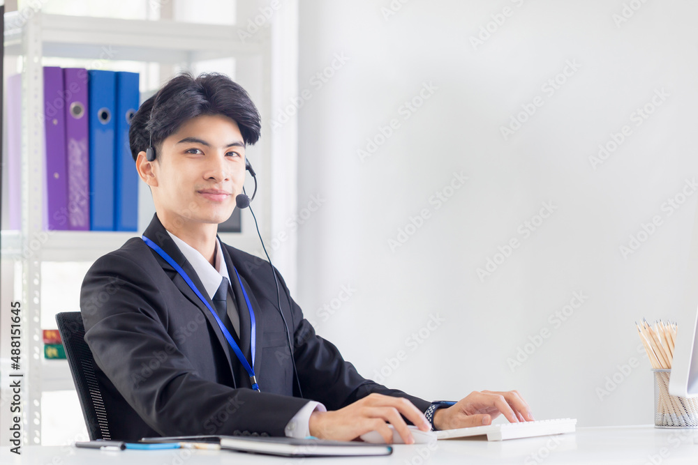 Happiness and smiling young operator man with headset, Professional operator service concepts Happiness and smiling young operator man with headset, Professional operator service concepts