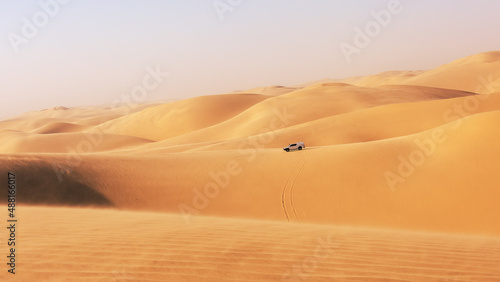 The car drives through the dunes of Sandwich Harbor. Namibia