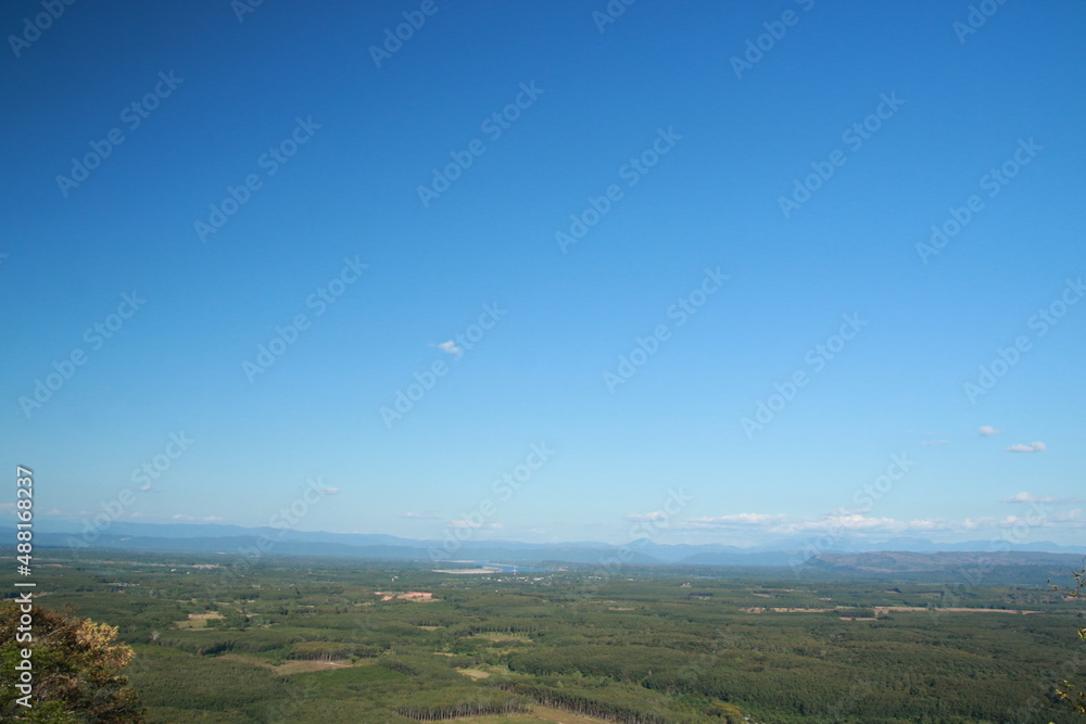 Fototapeta premium Panoramic landscape of mountains and rocks in the thailand alps with blue sky and clouds. Beautiful outdoor beauty of bluesky hills.
