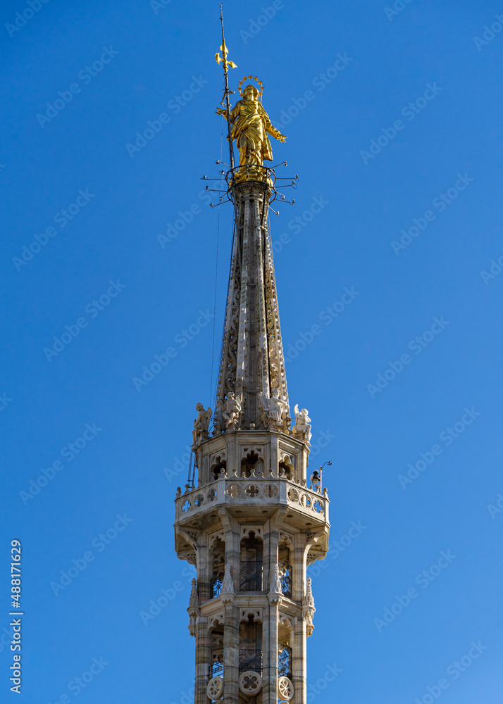 Gold Madonna (Madonnina) statue at the top of the Milan cathedral, Italy Gold Madonna (Madonnina) statue at the top of the Milan cathedral, Italy