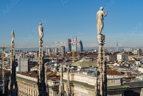 Scenic view of Milan historic center and modern skyline from the spires of Milan Cathedral, Italy