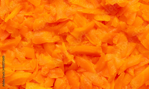 Orange boiled carrots as a background.