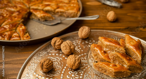 Baklava with nuts on a wooden background. Selective focus. © yanadjan