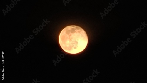 The Moon in close up, full moon in the night, dark night and yellow moon, moonlight, selective focus of the Moon