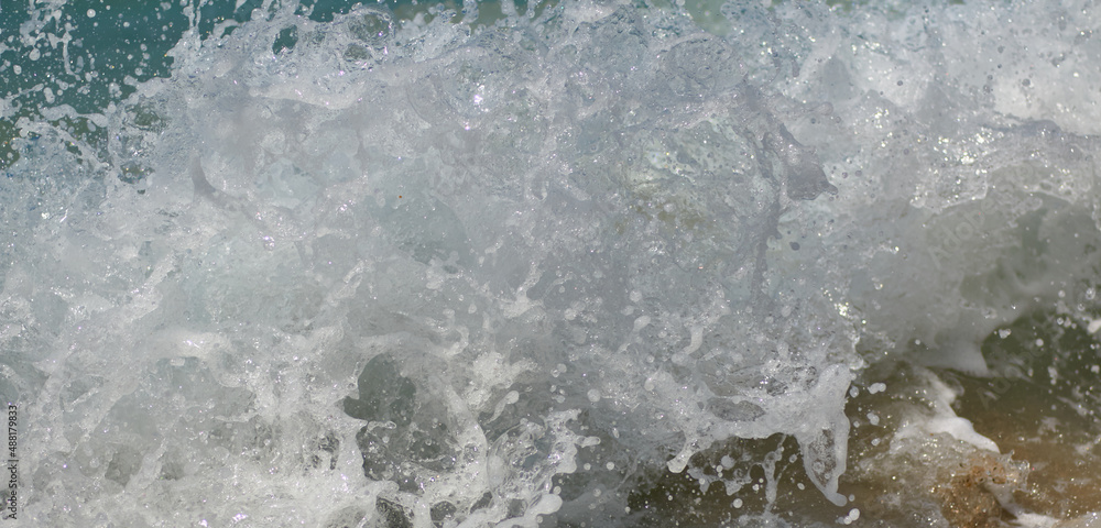 texture for desktop and screensaver, splashing surf on a rocky shore