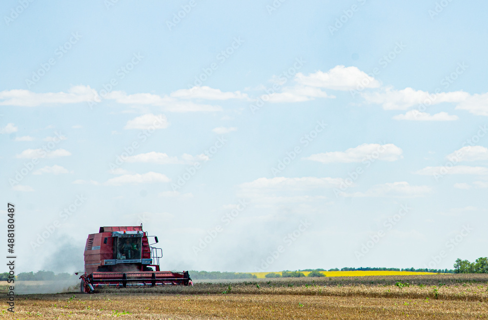 Harvester at work in the field Harvester at work in the field