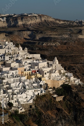 Amazing view of the famous village of Fira Santorini while the sun is setting