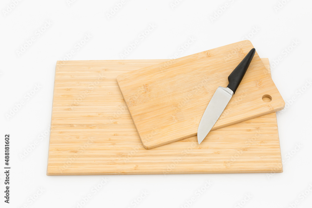 wooden boards and a knife on a white background
