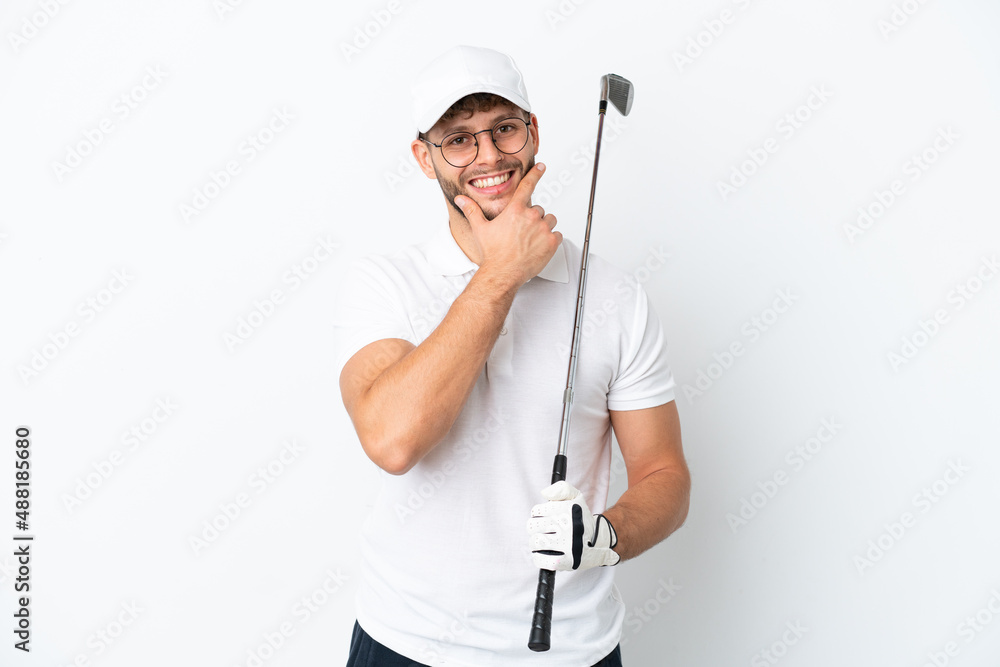 Handsome young man playing golf isolated on white background happy and smiling Handsome young man playing golf isolated on white background happy and smiling
