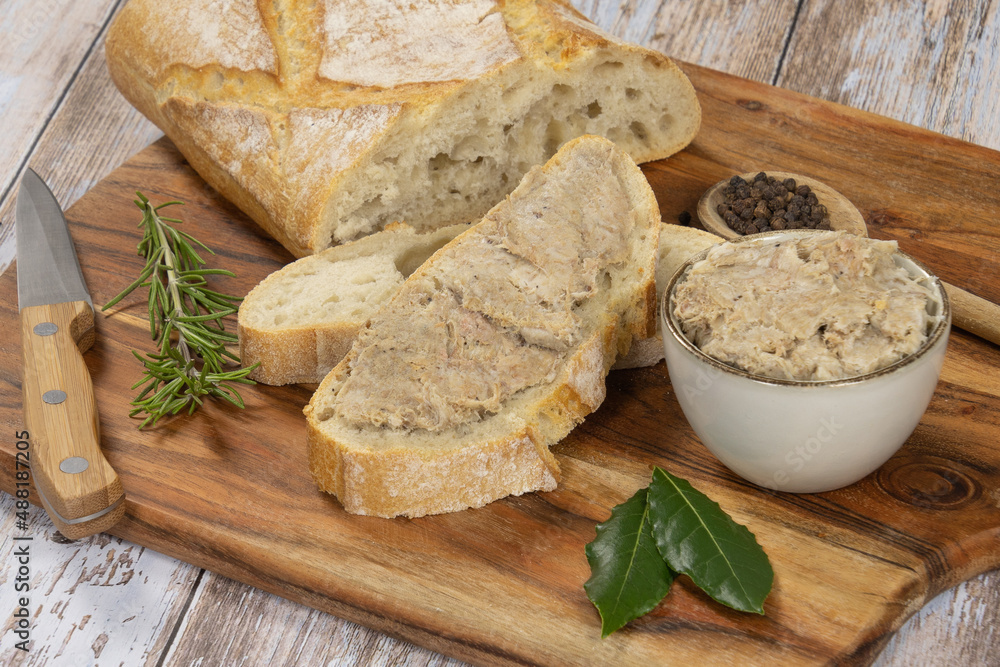 slice of bread with rillette on a wooden board slice of bread with rillette on a wooden board