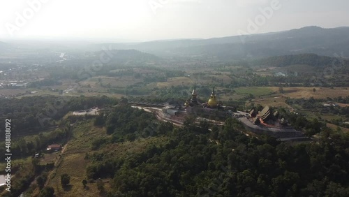 Wat Somdet Phu Ruea Ming Mueang Temple 4k fly over aerial view. Temple is built with fine wood timber. The church is made of teak and locate on mountain and best viewpoint at Phu ruea, Loei, Thailand photo